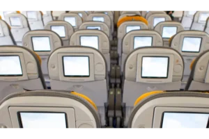 Info screens on the back of a row of plane passenger seats